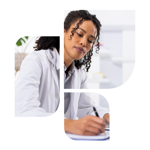 Veterinarian writing on pad of paper at computer