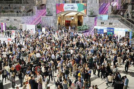 Crowd of people in the Grand hall of the convention center.