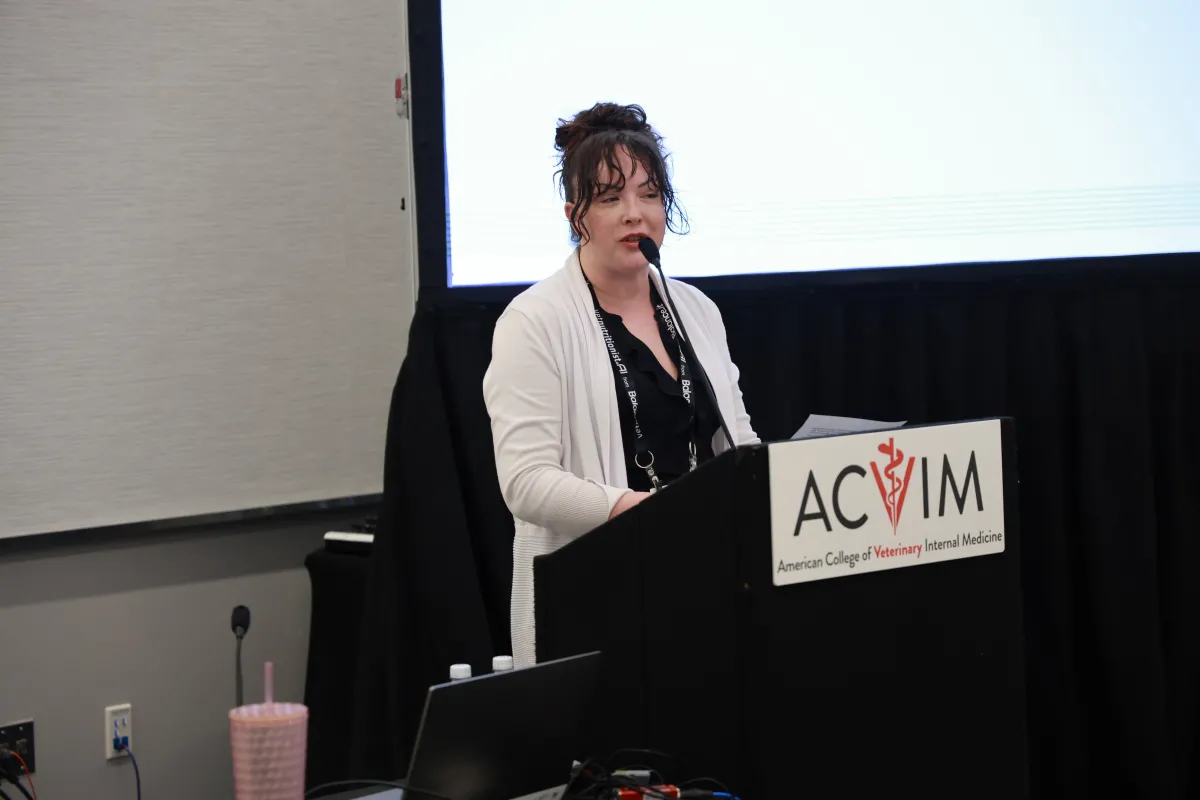 woman speaking at podium