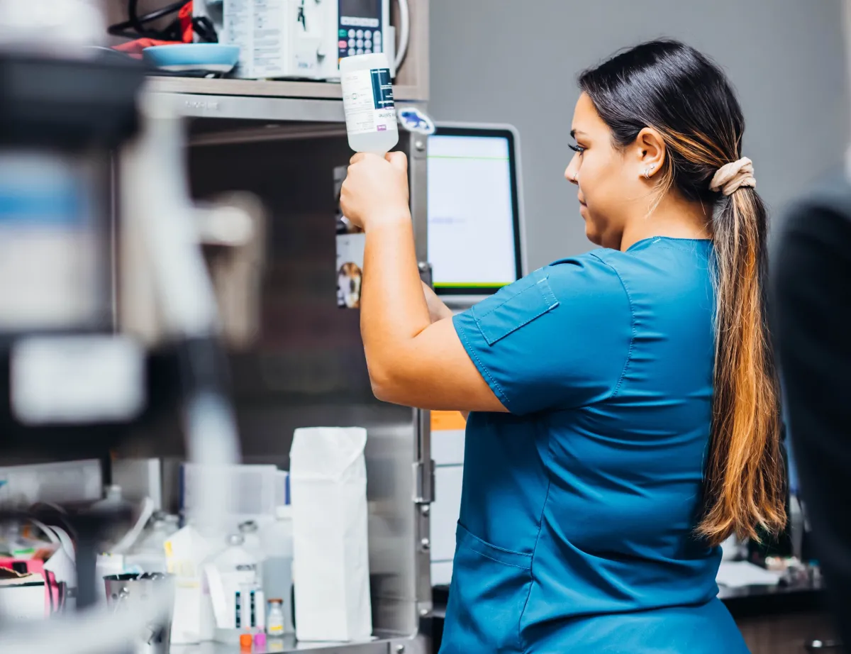 Vet Tech filling syringe