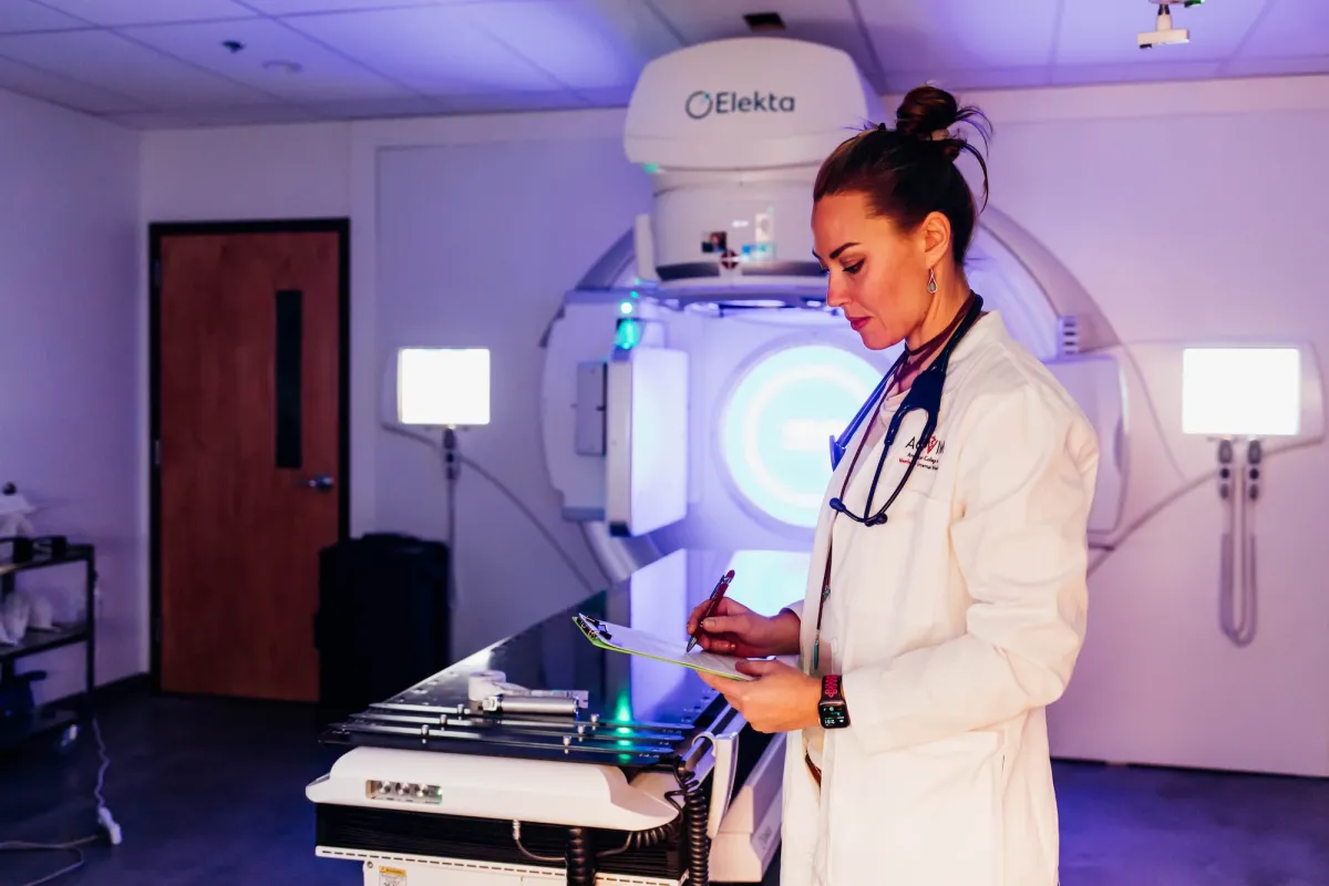 Specialist in front of MRI machine