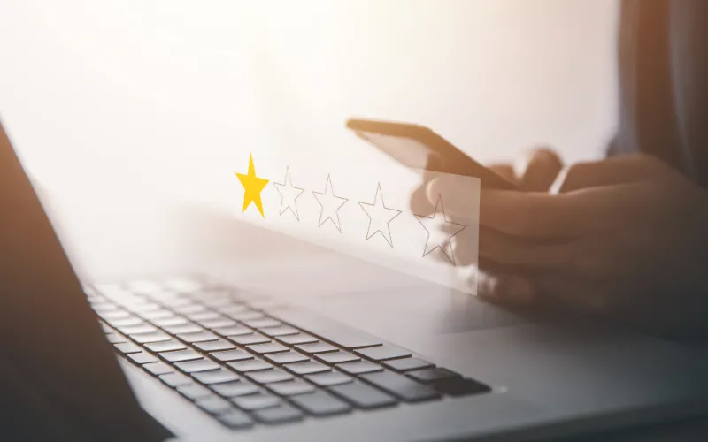 Computer with simulated one-star review graphic