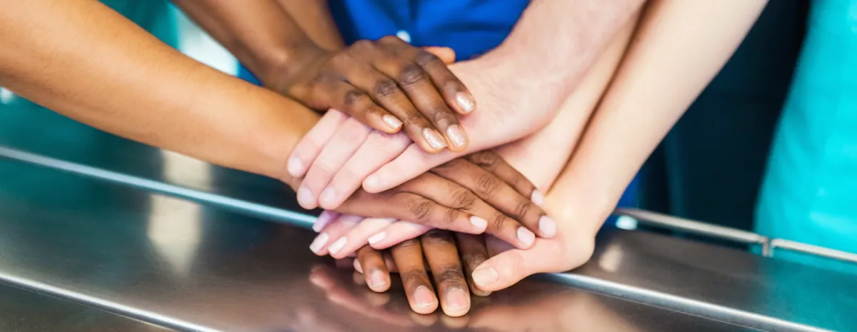 Diverse hands on exam table