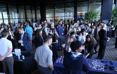 Attendees at Colleagues and Cocktails looking at booths