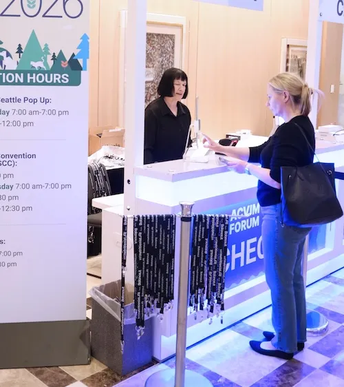 Lanyards visible next to a check in desk