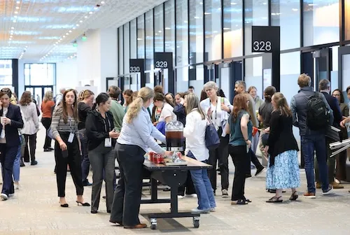 Attendees gathering around table with concesssions