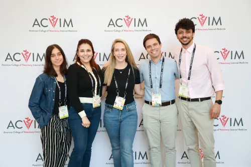 group of men and women posing for a photo
