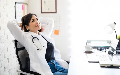 Veterinarian sitting and reflecting