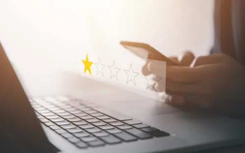 Computer with simulated one-star review graphic