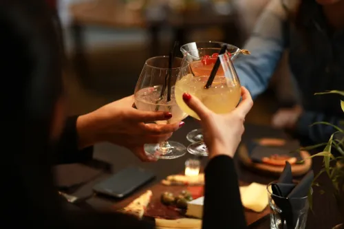 People toasting with glasses