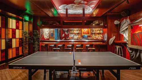 ping pong table in front of bar