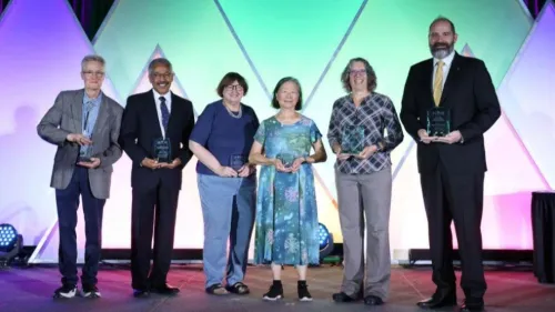 Al Jergens, Jody Lulich, Janice Kritchevsky, Ruthanne Chun, Chris Sanchez and Chris Fulkerson pose on stage during the 2026 ACVIM Awards Ceremony