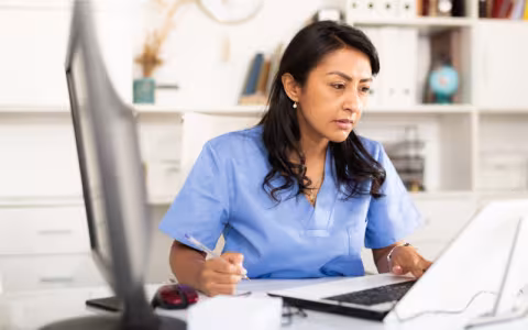 Veterinarian working on a laptop