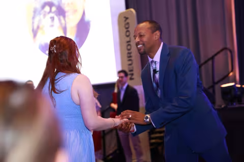 ACVIM president shaking hands with award recipient