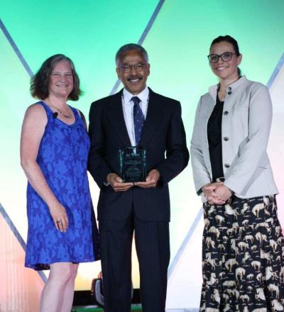 Sarah Gillings, Jody Lulich, and Cameon Ohmes pose on stage during the 2026 ACVIM Awards Ceremony