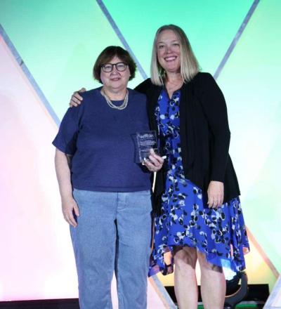 Janice Kritchevsky, Sandy Taylor pose on stage during the 2026 ACVIM Awards Ceremony