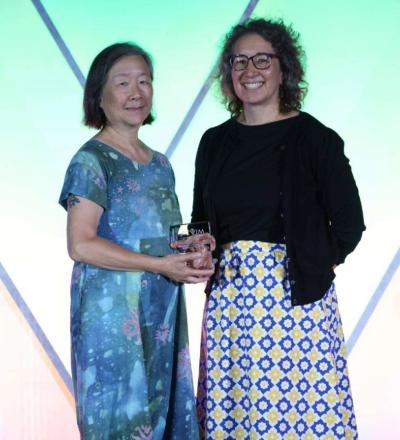 Ruthanne Chun and Jenna Burton pose on stage during the 2026 ACVIM Awards Ceremony